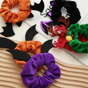 Collection of velvet Halloween and Christmas hair ties with bat and reindeer decorations