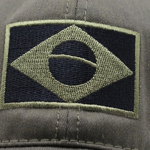 Detailed close-up of embroidered Brazil flag patch on military style baseball cap