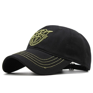 Detail shot of a tactical black baseball cap with olive green military embroidery and stitches