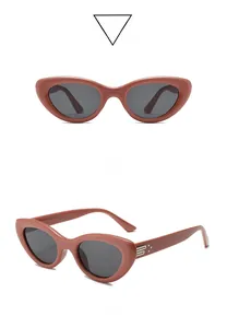 Front and side views of Bordeaux cat-eye sunglasses with gray lenses and metal accents