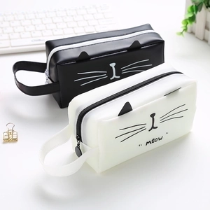 Close-up of cat-themed makeup brush holders with 3D ears and 'MEOW' printed detail