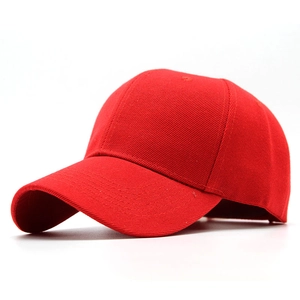 Detail of red six-panel baseball cap showing thick twill cotton fabric and curved brim