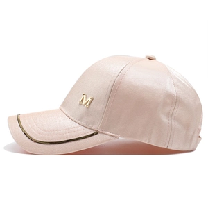 Pink satin baseball cap with metallic gold M letter and decorative brim trim