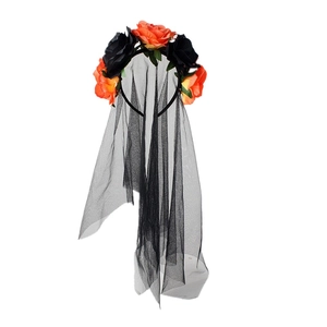 Detailed macro view of orange and black roses with elegant gothic mesh veil