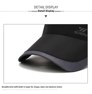 Detail of black sun hat featuring grey honeycomb breathable mesh and shaped visor