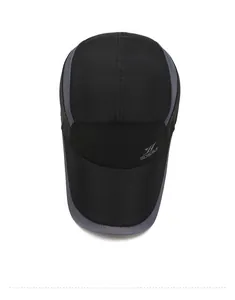 Detail of black quick-dry baseball cap featuring breathable grey mesh side panels and logo