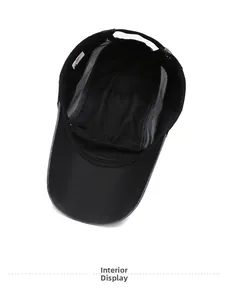 Interior view of black mesh baseball cap showing breathable lining and adjustable strap