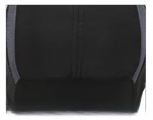 Detailed close-up of double-stitched seams on a durable black quick-dry baseball cap