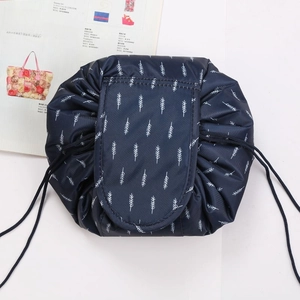 Navy blue drawstring makeup bag, portable travel wash bag with white leaf print variant.