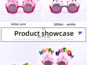 Detail view of cupcake and Happy Birthday themed party glasses in pink and white