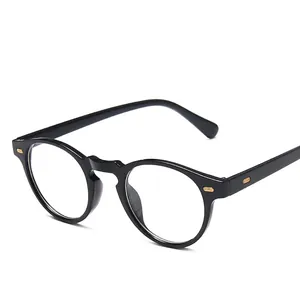 Retro black round frame glasses with gold hinge accents and clear lenses on white background
