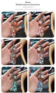 Detail of colorful gradient acrylic dinosaur keychains with metallic lobster clasps and rings
