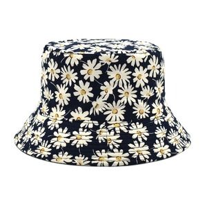 Reversible daisy print bucket hat in dark blue canvas for outdoor sun protection