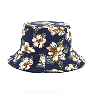 Double-sided sun bucket hat featuring vibrant navy floral print and zebra pattern