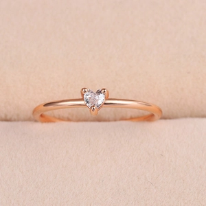 Minimalist rose gold ring featuring a heart-shaped zircon in a three-prong setting