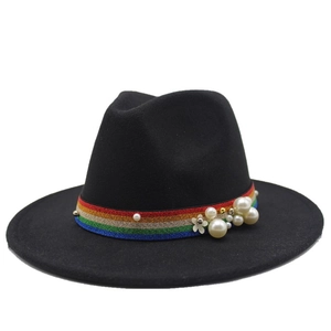 Detail of black wool fedora with rainbow ribbon, white pearls and floral decoration