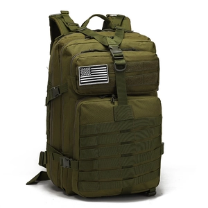 Detail of olive green tactical backpack with Molle system and flag patch on front