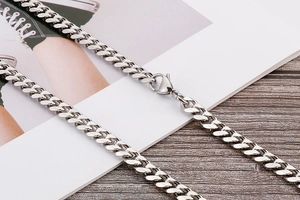 Polished silver stainless steel Cuban link body chain with a lobster clasp closure