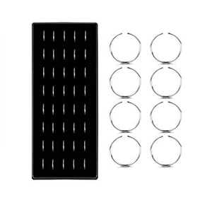 Close-up of 40 silver stainless steel C-shaped nose rings in a black display tray