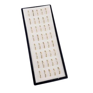 Black jewelry display tray featuring 40 pieces of golden C-shaped stainless steel nose rings