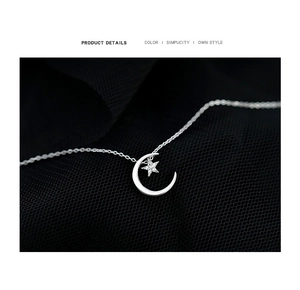 Detailed macro shot of 925 sterling silver moon and star pendant with sparkling zircon