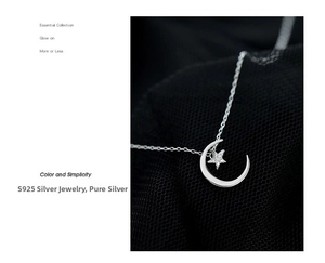 Macro detail of S925 sterling silver moon and star pendant with sparkling zircon inlay
