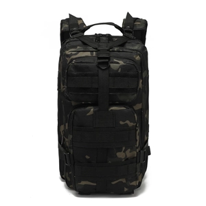 Detail view of tactical backpack with MOLLE webbing and multiple zippered compartments