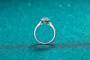Macro detail of S925 sterling silver halo ring with round moissanite and side stones