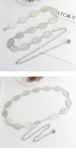 Detailed view of silver leaf chain belt featuring leaf-shaped links and flower charm