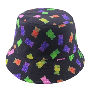 Double-sided sun hat featuring colorful gummy bear patterns on black canvas fabric