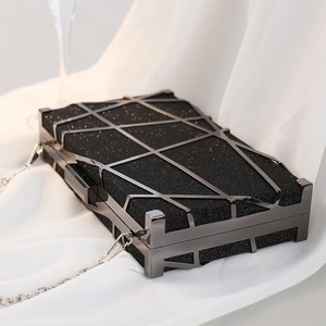 Elegant black glitter hard shell evening clutch with geometric gunmetal frame and chain