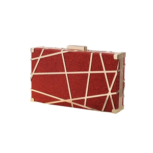 Elegant wine red sequin clutch with gold geometric lines and metallic frame