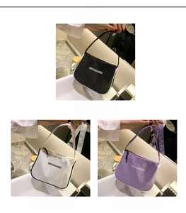 Detail of minimalist nylon shoulder bags in black, white, and purple with zipper closure