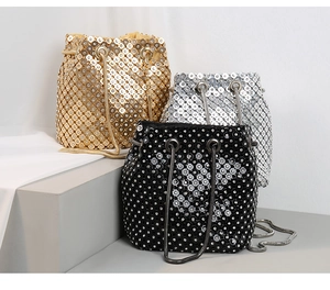 Trio of sparkling bucket bags in gold, silver, and black with sequin metal finish
