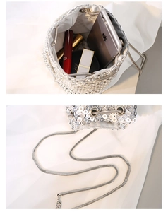 Internal view showing storage capacity for phone and lipstick in silver bucket bag