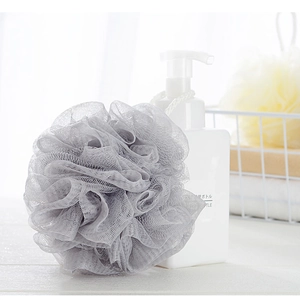 Close-up of a grey soft mesh bath sponge made from high-density PE material with hanging cord