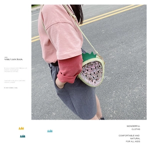 Kids strawberry glitter crossbody bag in pink and purple with green leaf detail