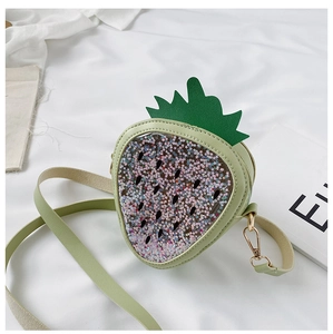 Close-up of strawberry-shaped green crossbody bag with colorful sequin-filled PVC window