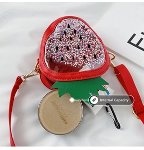 Macro detail of strawberry-shaped kids sequin bag showing spacious interior capacity