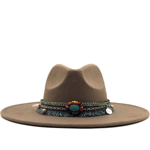 Brown wool felt fedora with ethnic beaded band and turquoise accent on white background