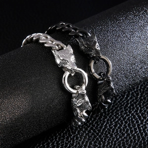 Men's punk wolf head bracelet with silver and black steel cuban chain on leather stand