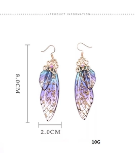 Detailed view of long butterfly wing earrings with blue-purple gradient and gold foil