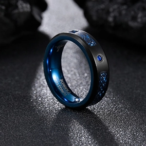 Black and blue tungsten carbide ring with carbon fiber dragon inlay and blue zircon stone