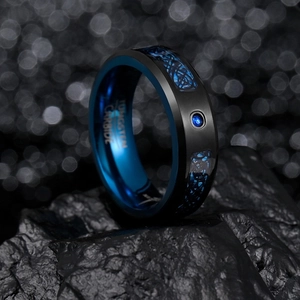 Men's matte black tungsten ring with blue celtic dragon inlay and sparkling blue zircon