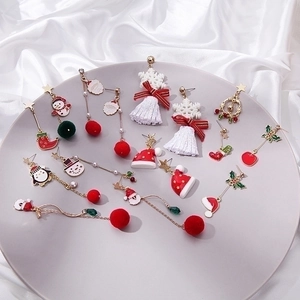 Asymmetric Christmas earrings set featuring reindeer, snowman and gingerbread man designs