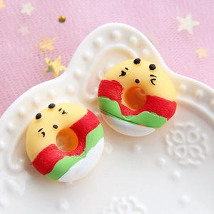 Cute colorful resin donut charms with faces on white relief plate for DIY crafts