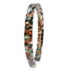 Detail view showing the sleek texture and tortoiseshell pattern of the 1.5cm acetate headband