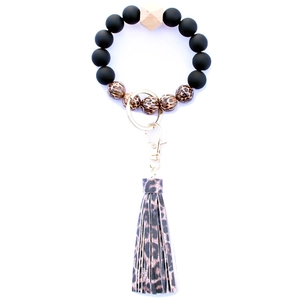 Close-up of leopard print beads and leather tassel on a beaded wristlet keychain