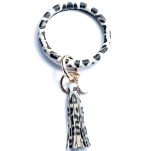 Detail of leopard print PU leather keychain bracelet with golden alloy ring and tassel
