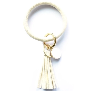 Creamy white PU leather keychain wristlet featuring gold metal ring and fringe tassel detail